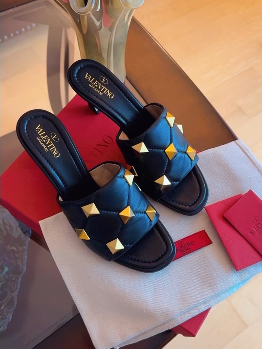 Valentino Garavani Black Quilted Leather Slide Mules with Gold Roman Studs
